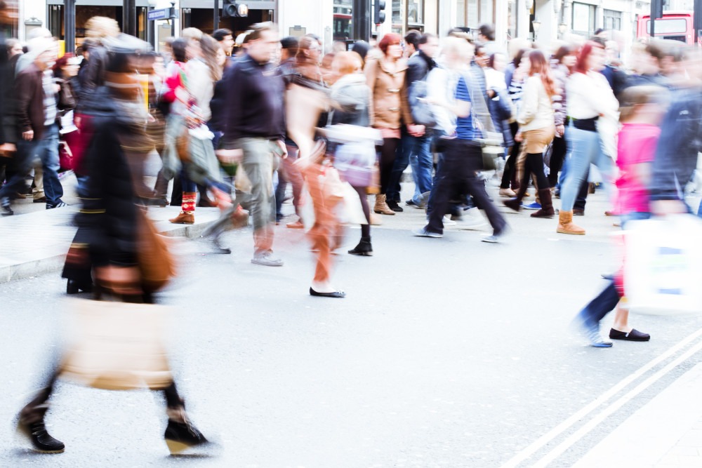 Blurry Photo of People On a Busy Street