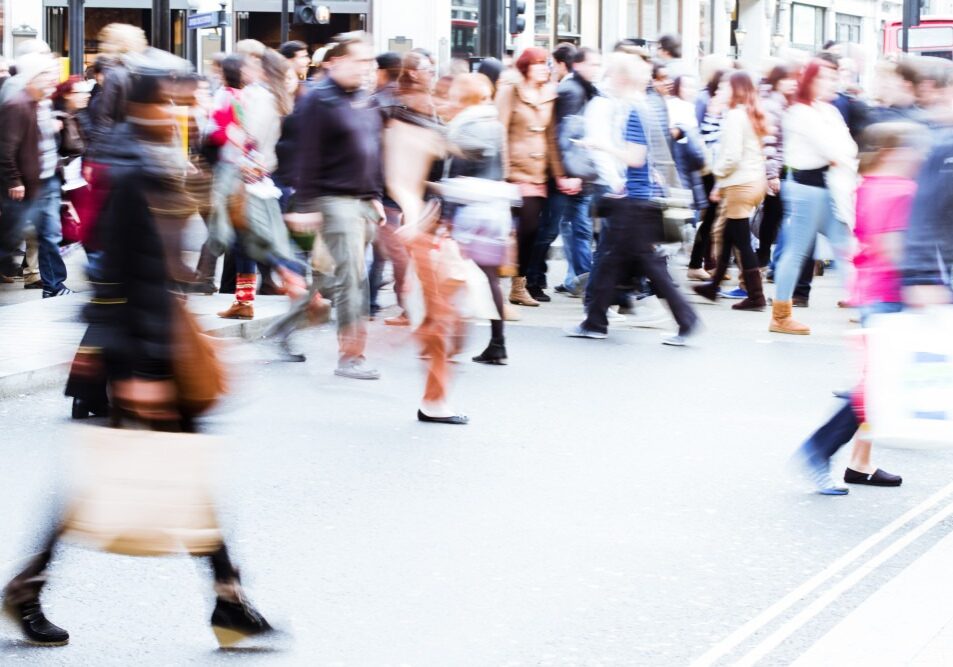 Blurry Photo of People On a Busy Street